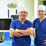 Prof. Vedat Topsakal and Prof. Paul Van de Heyning after first robotic cochlear implantation with HEARO robot from CAScination