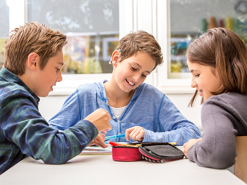 Children learning together at school