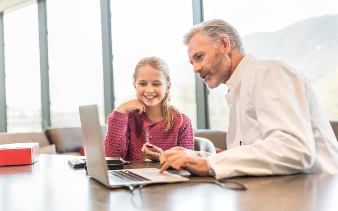 Audiologist helping patient
