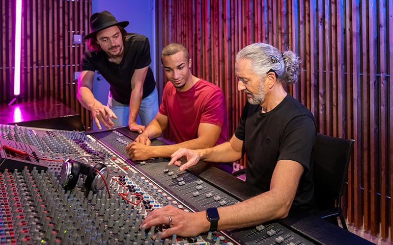group of people in a recording studio