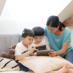 Woman supporting children with cochlear implant