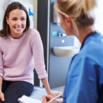 woman discussing CI with doctor