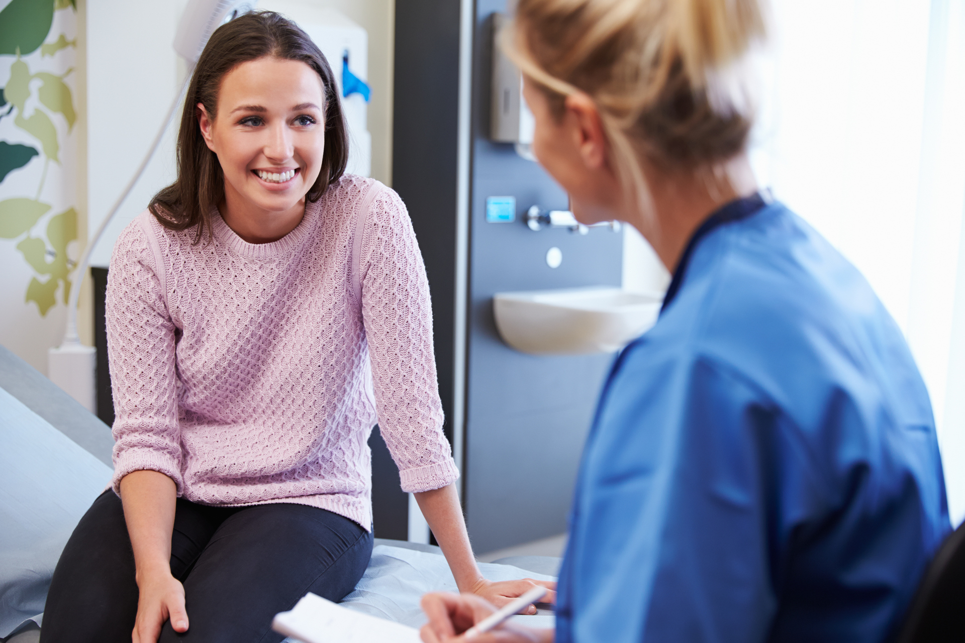 woman discussing CI with doctor
